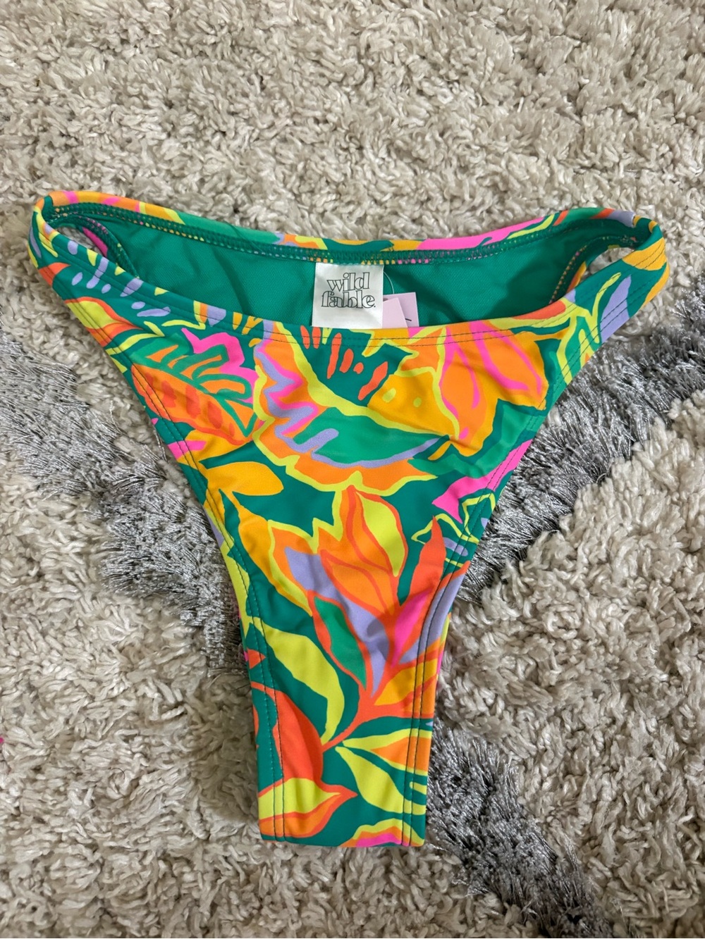 Kids colorful swim bottoms with size tag